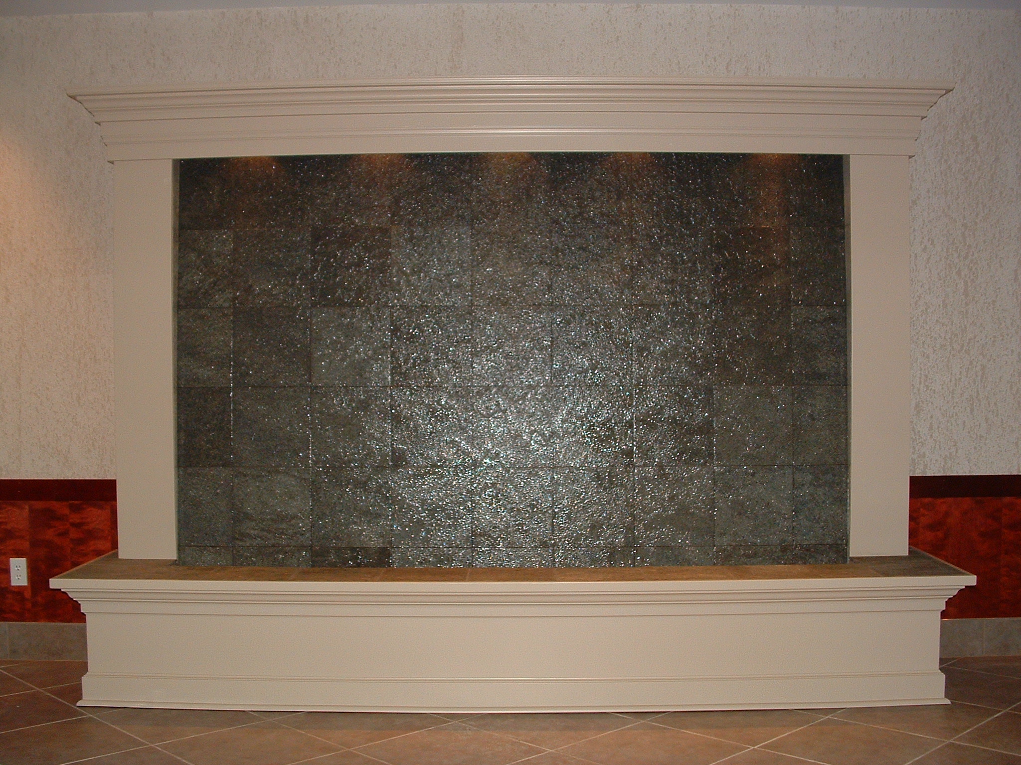 Bellingham WA. hotel. 12 ft x 7 ft tall quartz tile backdrop white painted molding lighting in valance, existing building.
