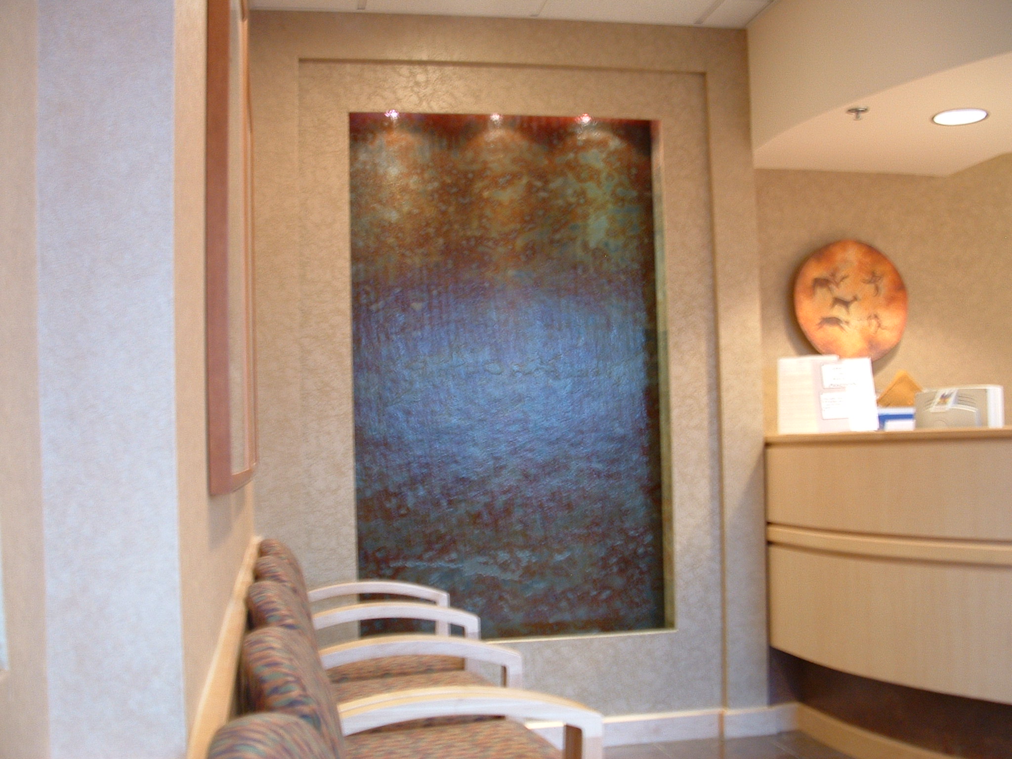 Federal way, WA digestive health specialist waiting room. 4 ft x 8ft slab of rustic   slate back drop lighting in valance new construction.