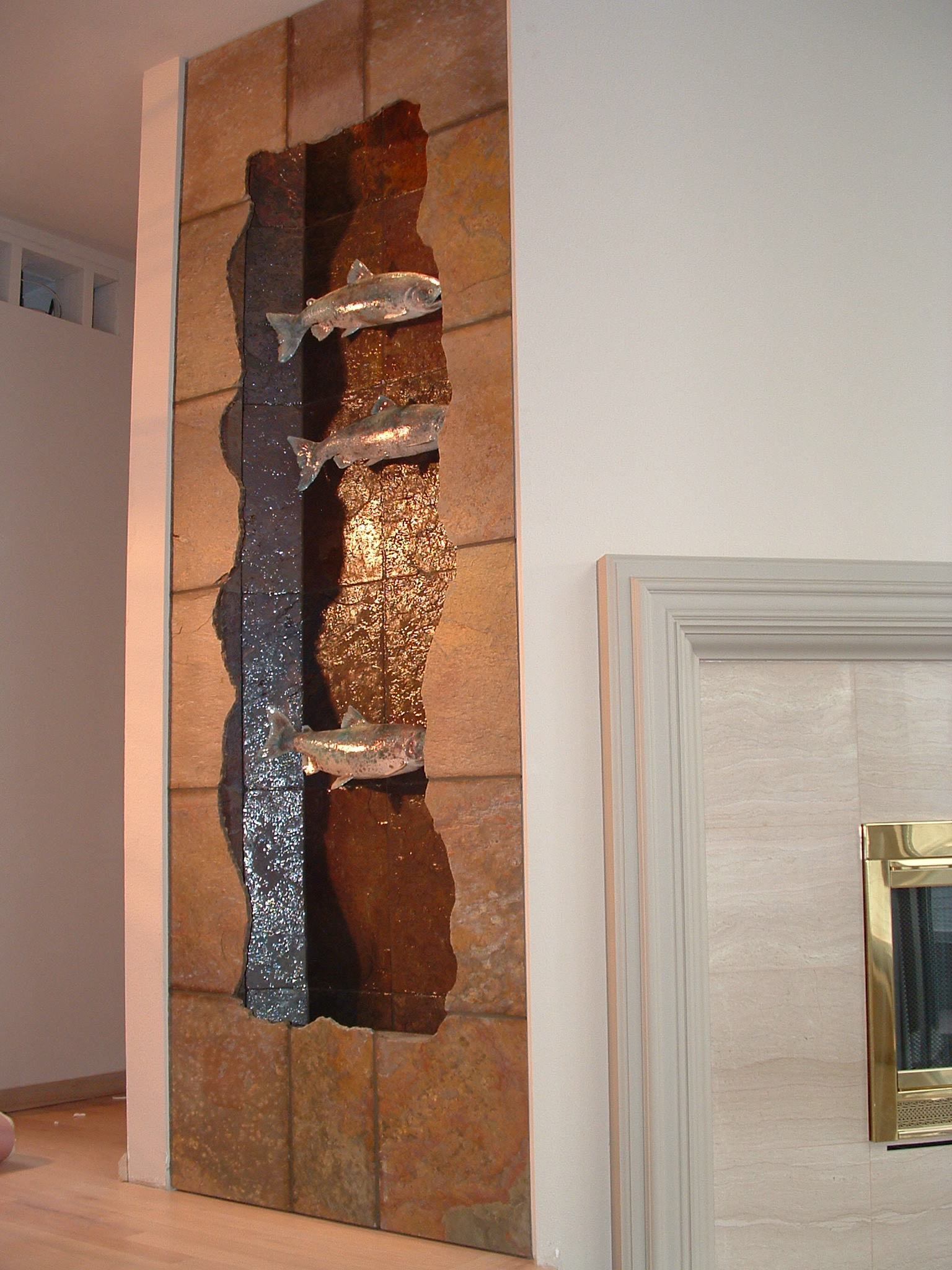 Seattle, WA. residence. 49 in x 7 ft tall-multicolored slate, three racue glazed salmon, lighting in valance, new construction.